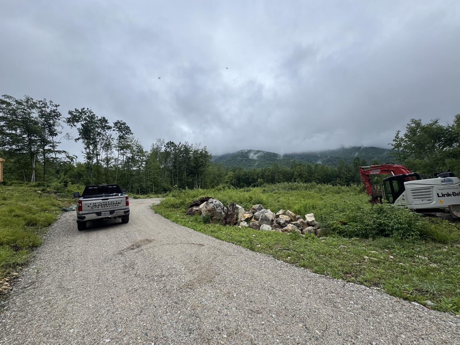 Langone truck and excavator on a new gravel drive